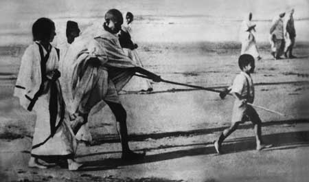 Poking his Grandson Kanu-Juhu, Bombay (Mumbai), 1938.jpg